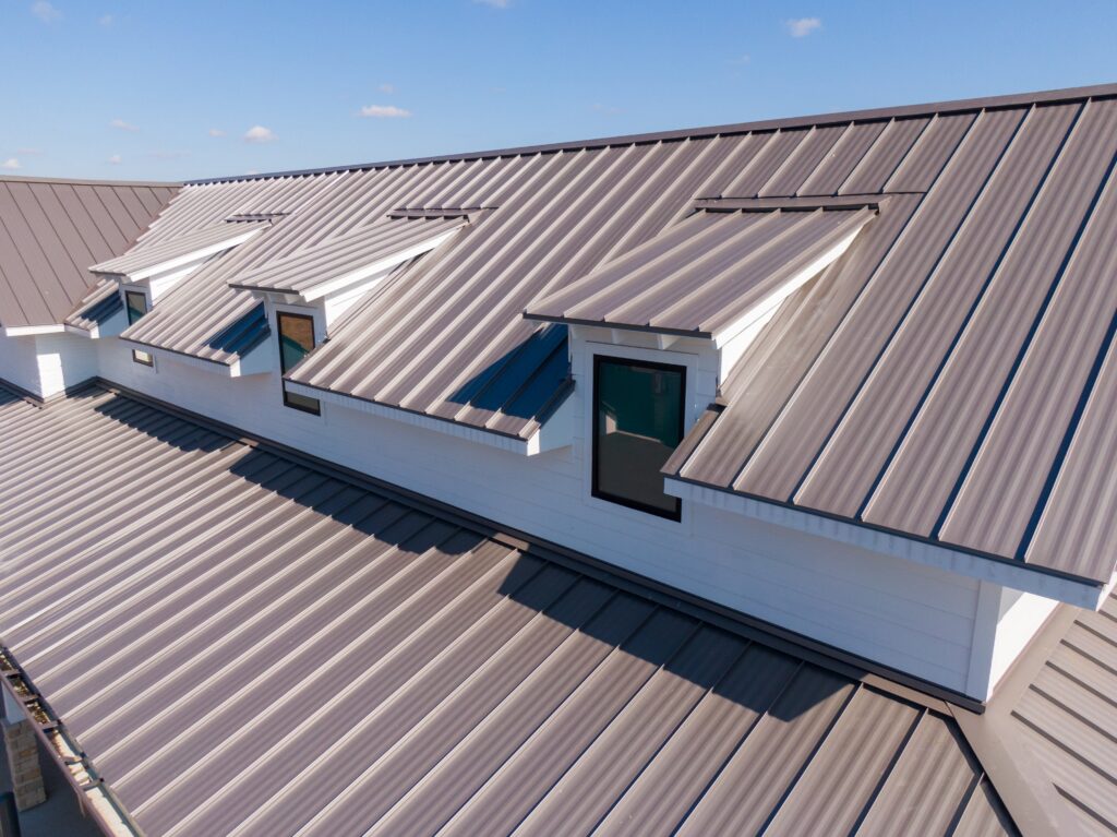 Modern standing seam metal roofing installed on a residential home, showcasing the durability, clean lines, and craftsmanship of I AM Roofing's metal roofing services.